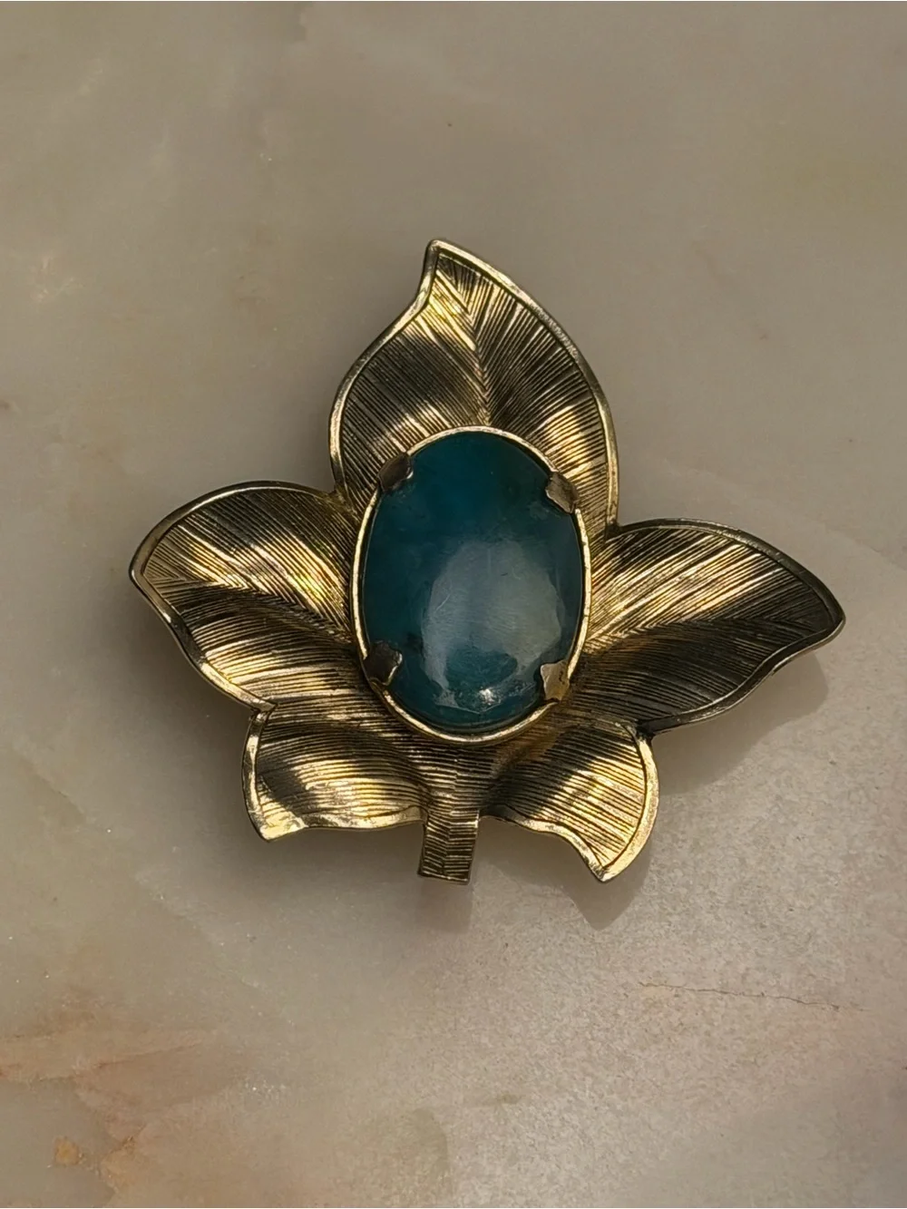 Silver tone leaf brooch with‎ blue cabochon stone pin